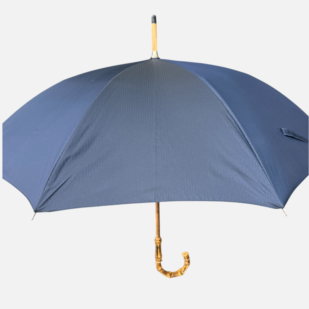A navy striped umbrella on a Wanghee handle