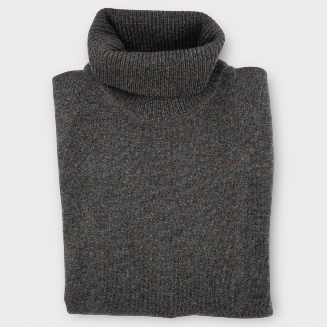 Folded gray turtleneck sweater on a light gray background