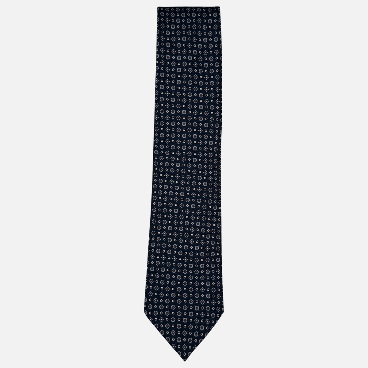 A navy necktie with miniature rosettes in a sky blue repeating.
