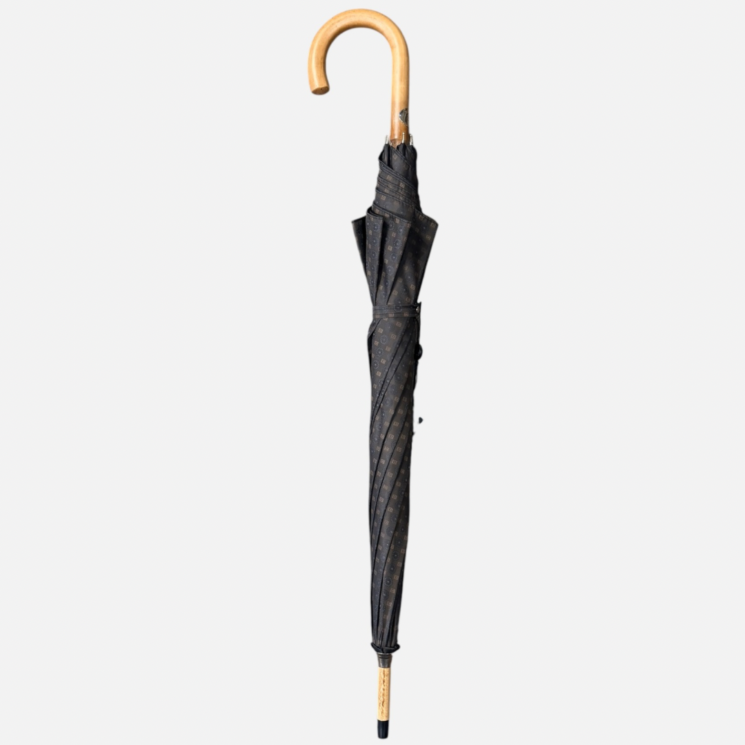 A brown Motif umbrella with a malacca handle