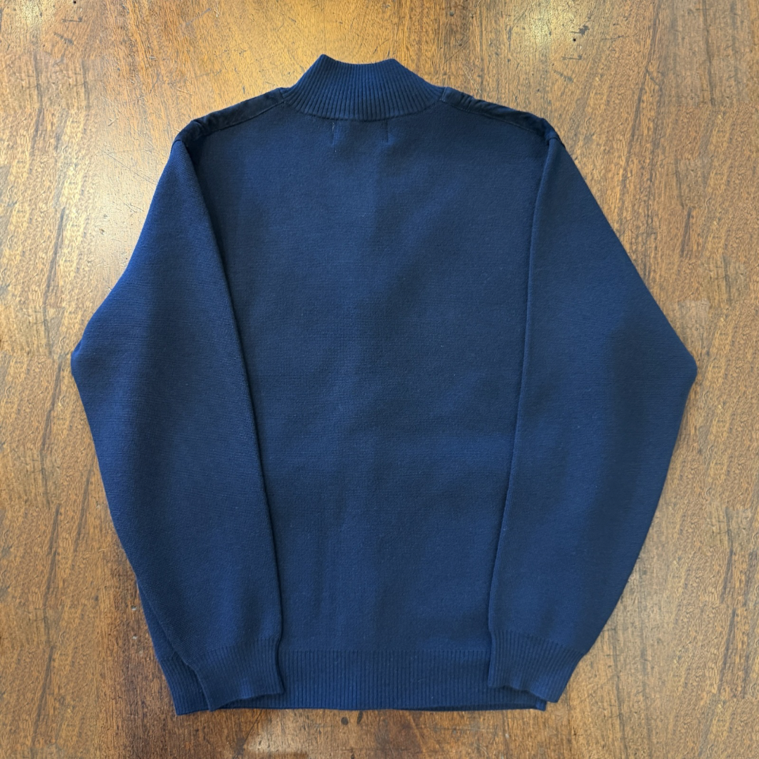 A Navy blue Suede front cardigan with knitted arms and back in Italian merino
Wool. 