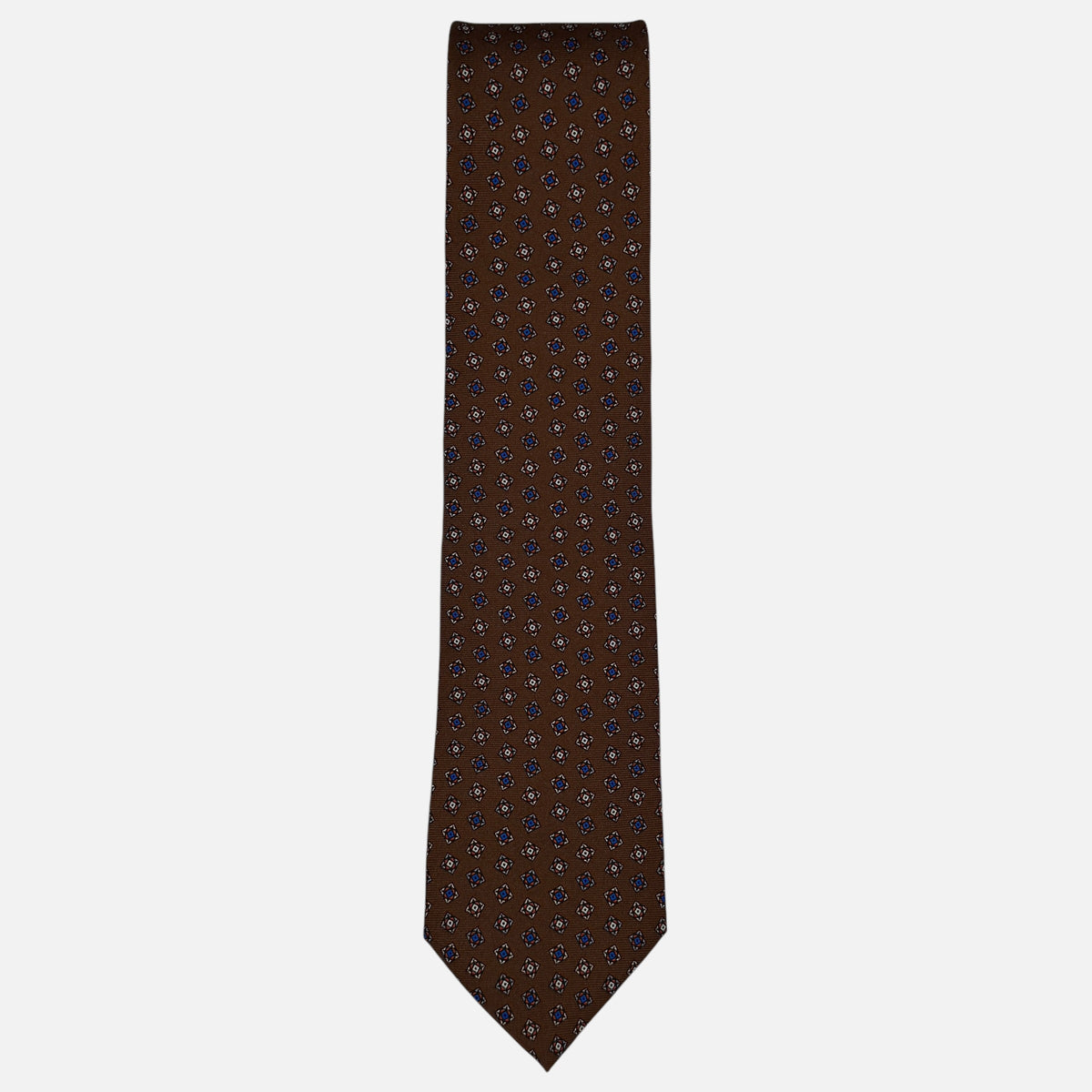 A chestnut coloured tie, with a medallion pattern. 