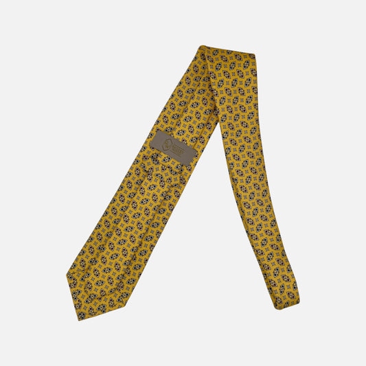 A yellow necktie with Geometric patterns.