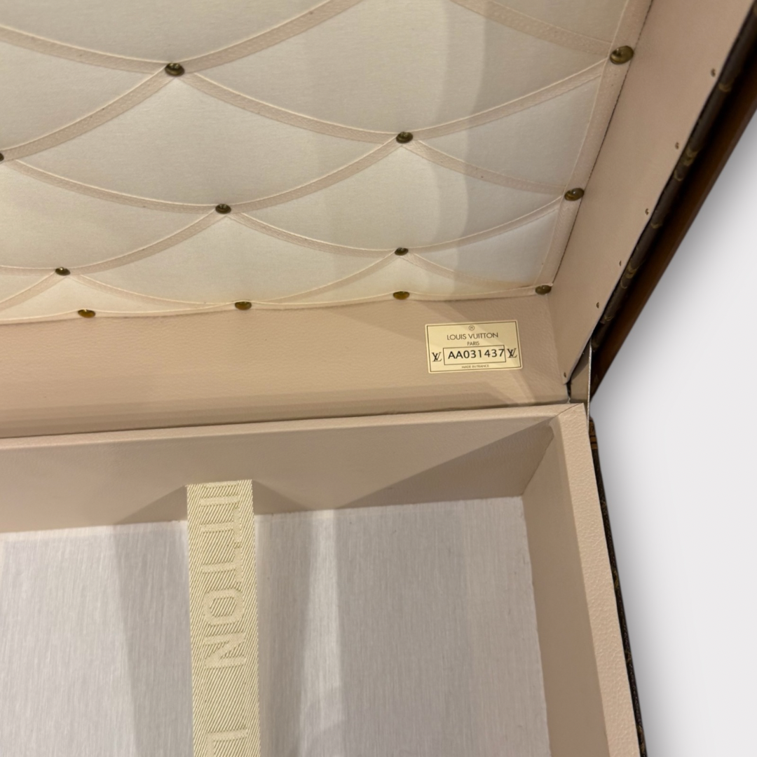 Louis Vuitton monogram trunk on a white background