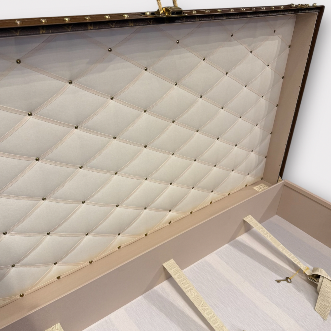 Louis Vuitton monogram trunk on a white background