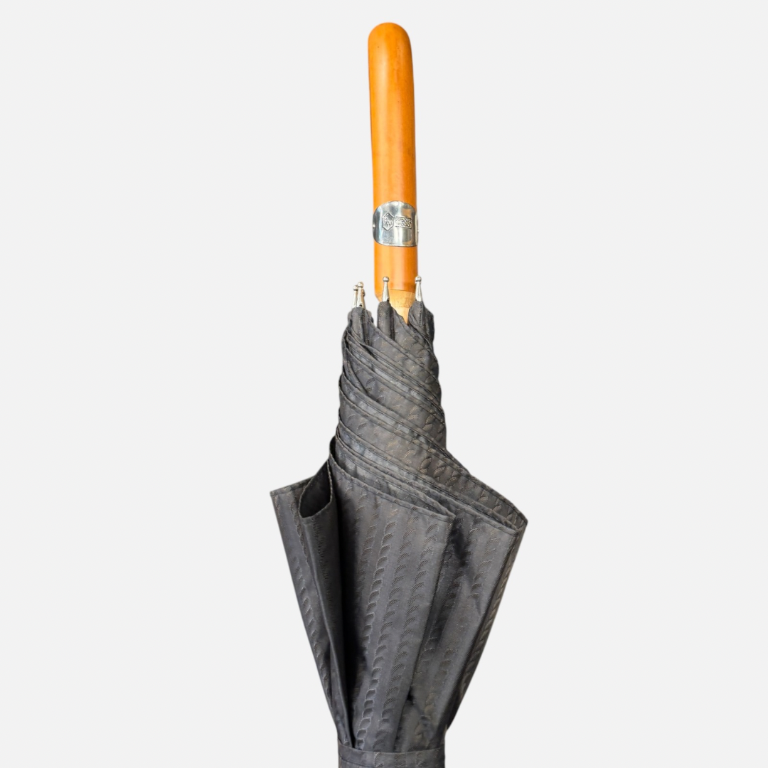 A brown rope umbrella On a malacca handle 