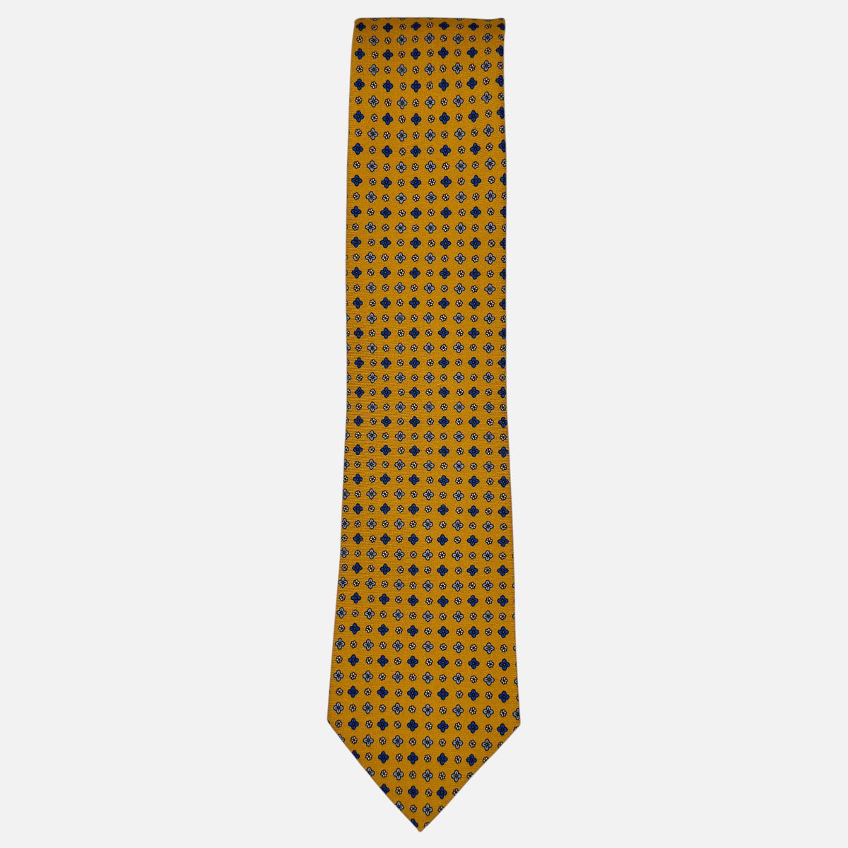 A mustard colour necktie with sky blue yellow and blue medallions. 