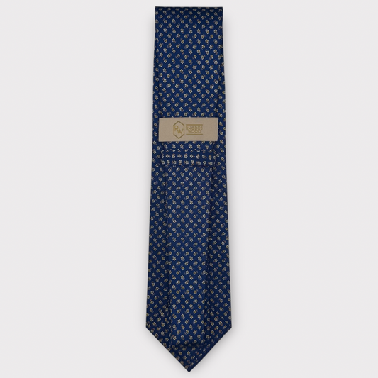 Classic silk necktie, printed in England, with a 9cm blade and 150cm length, laid flat against a plain background
