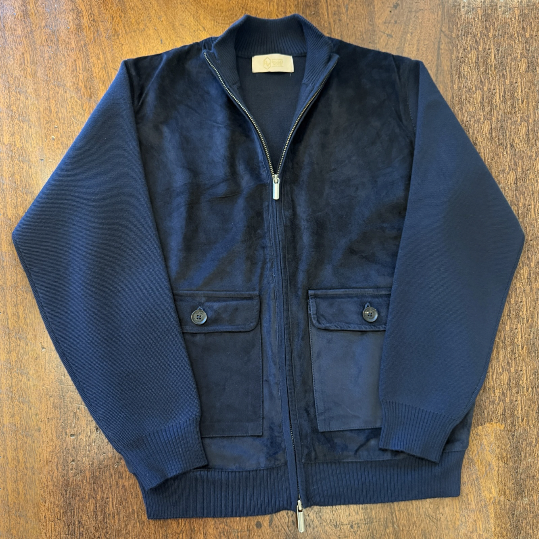A Navy blue Suede front cardigan with knitted arms and back in Italian merino
Wool. 