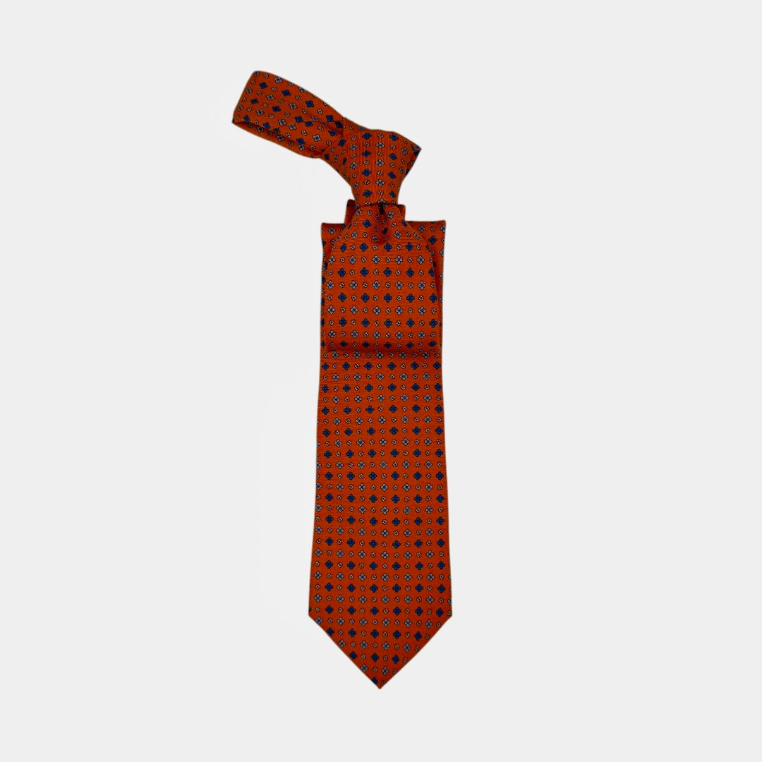 A Seville Orange necktie with medallions.