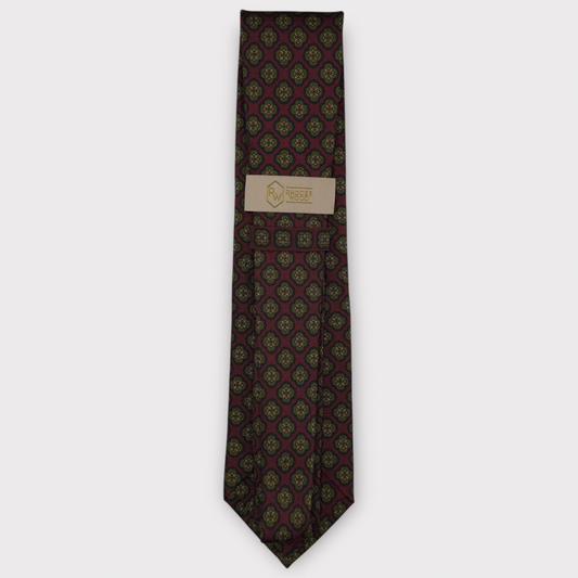 Classic silk necktie, printed in England, with a 9cm blade and 150cm length, laid flat against a plain background