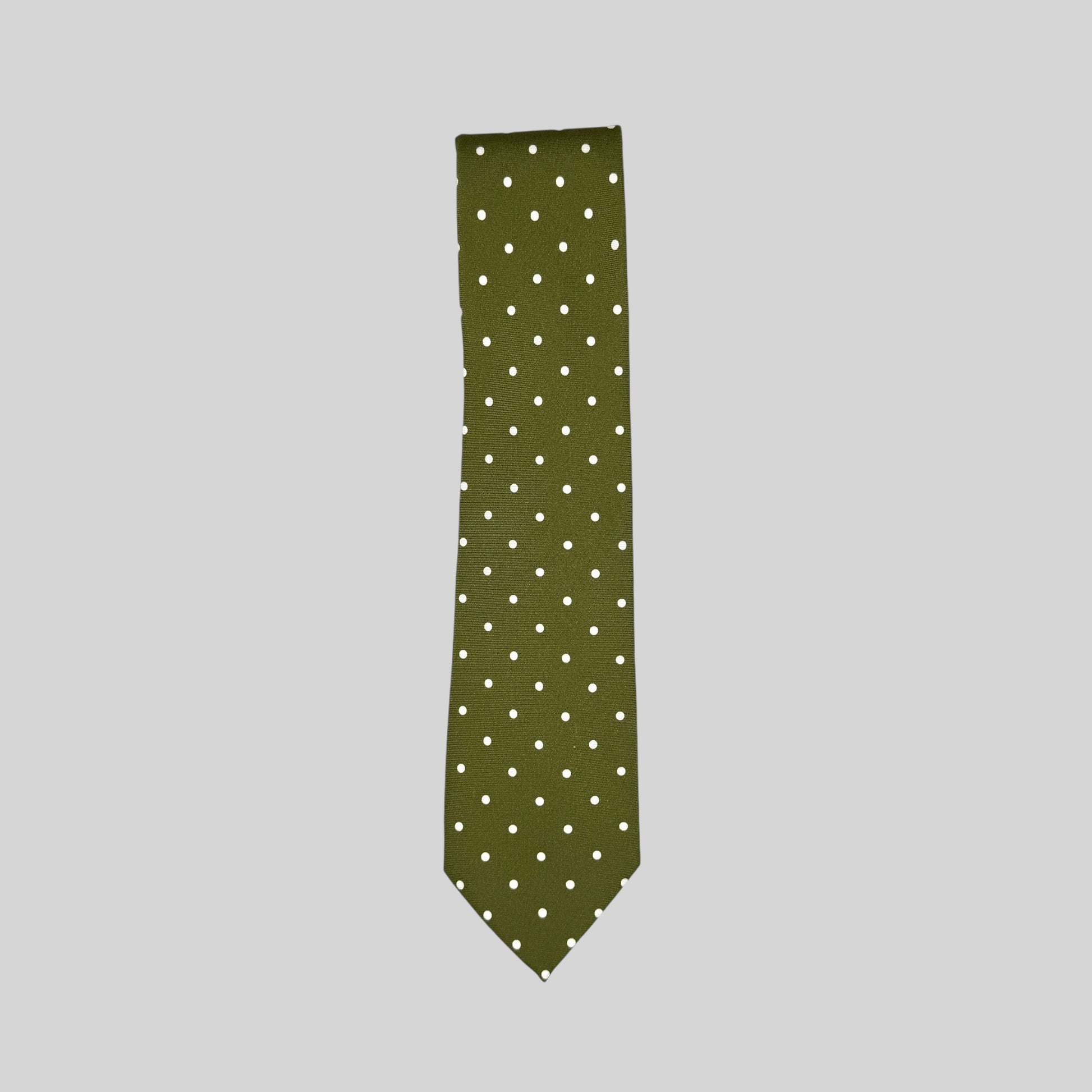 An olive green Rhodes Wood tie with white polka dots