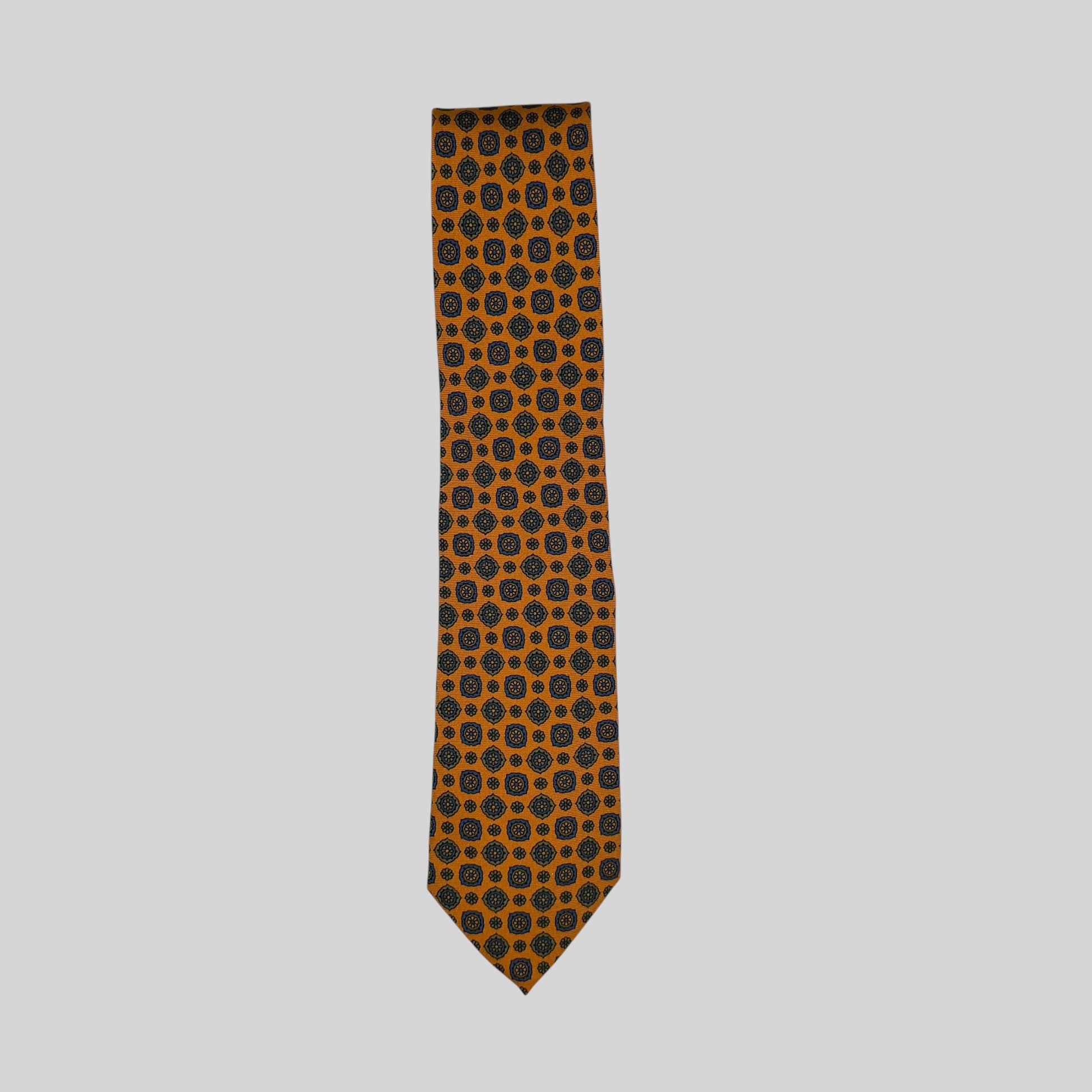 Rhodes Wood orange tie featuring green medallion print