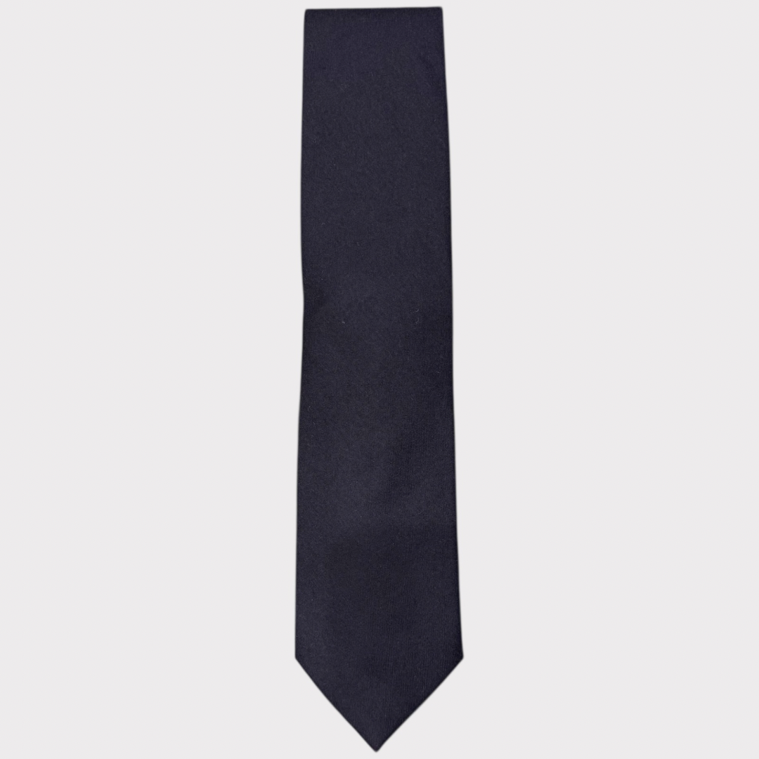 Navy blue tie on a light gray background