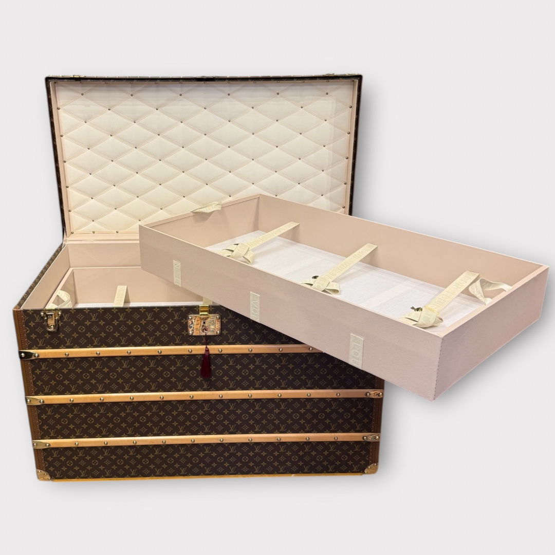 Louis Vuitton monogram trunk on a white background