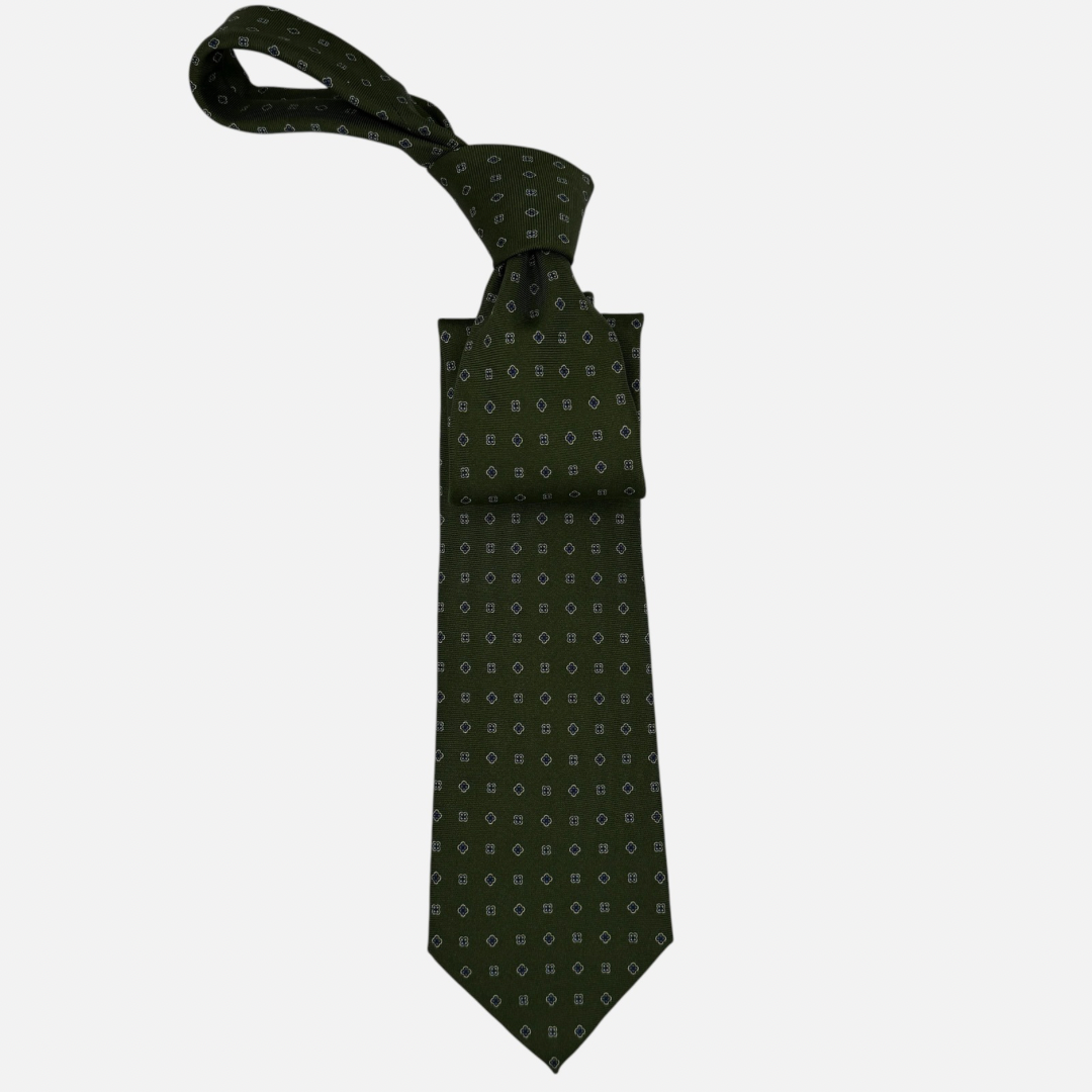 A bottle green necktie with small floral patterns. 