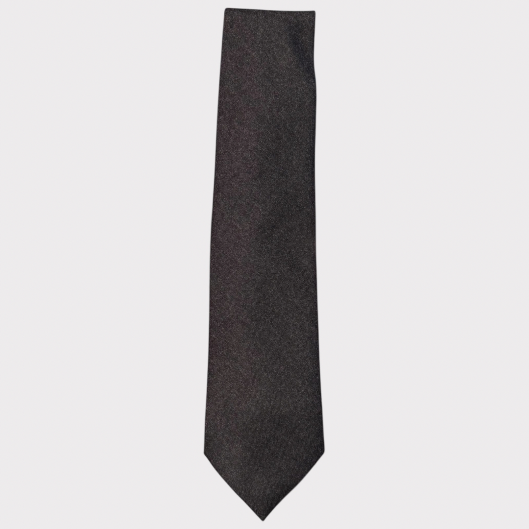 Dark gray tie on a light gray background