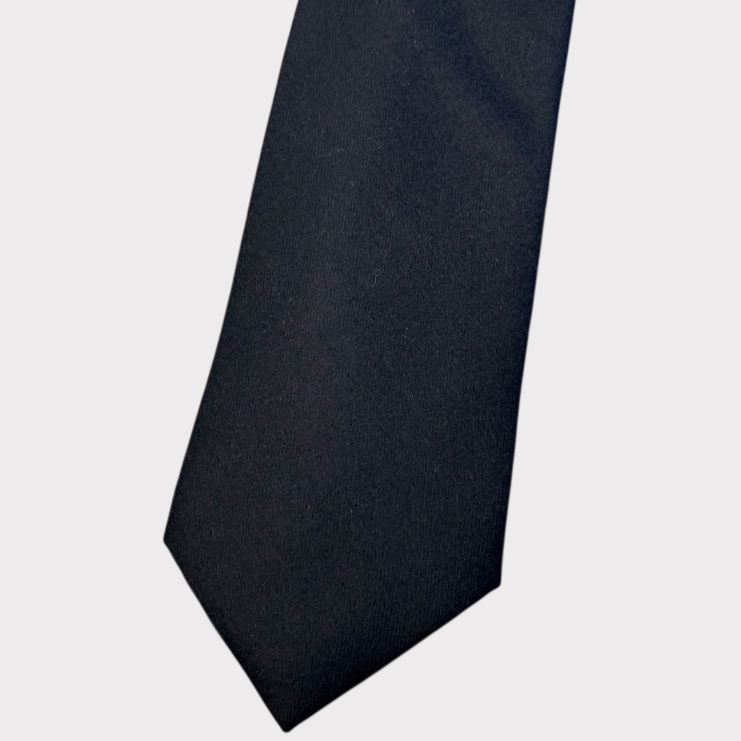 Black tie on a light gray background