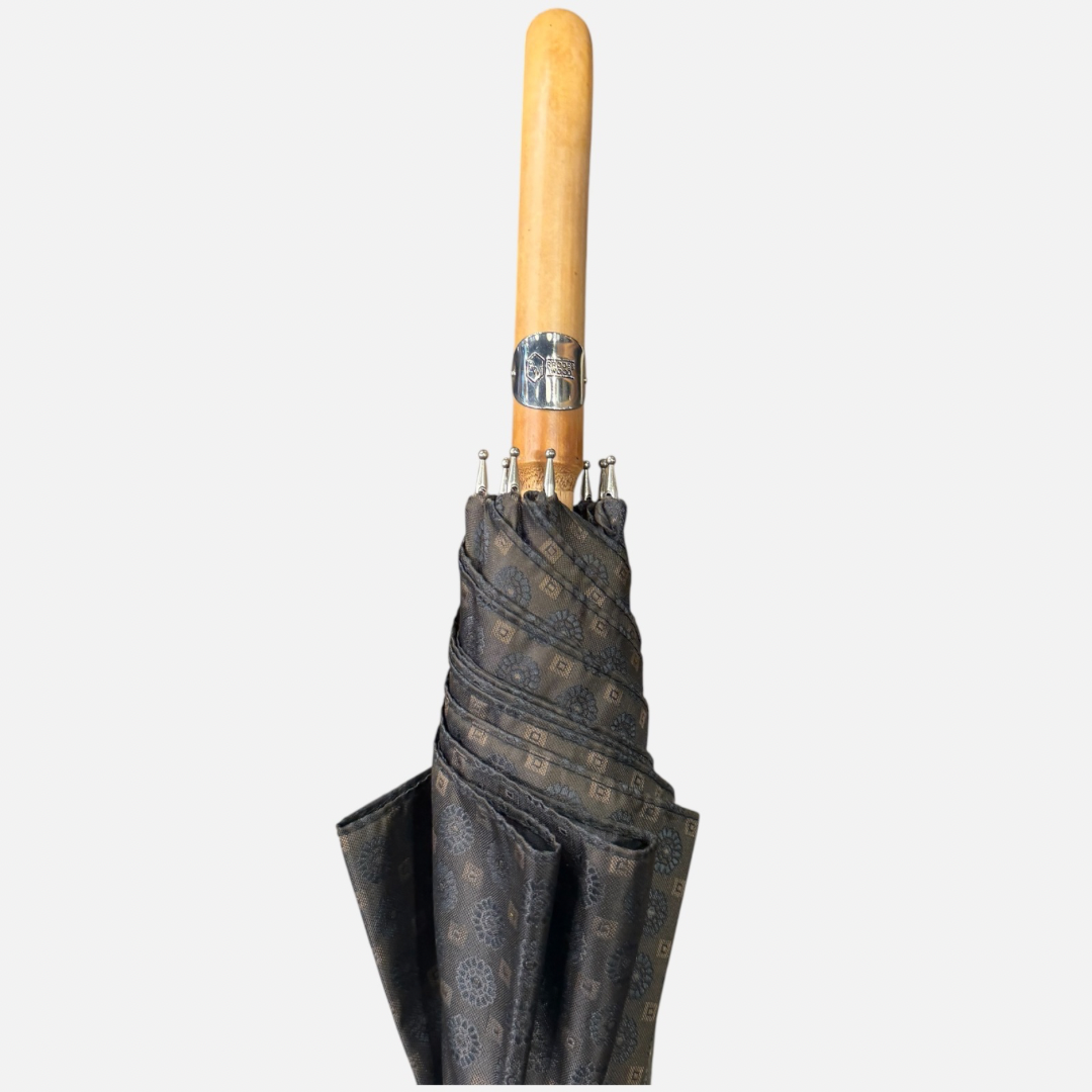 A brown Motif umbrella with a malacca handle 