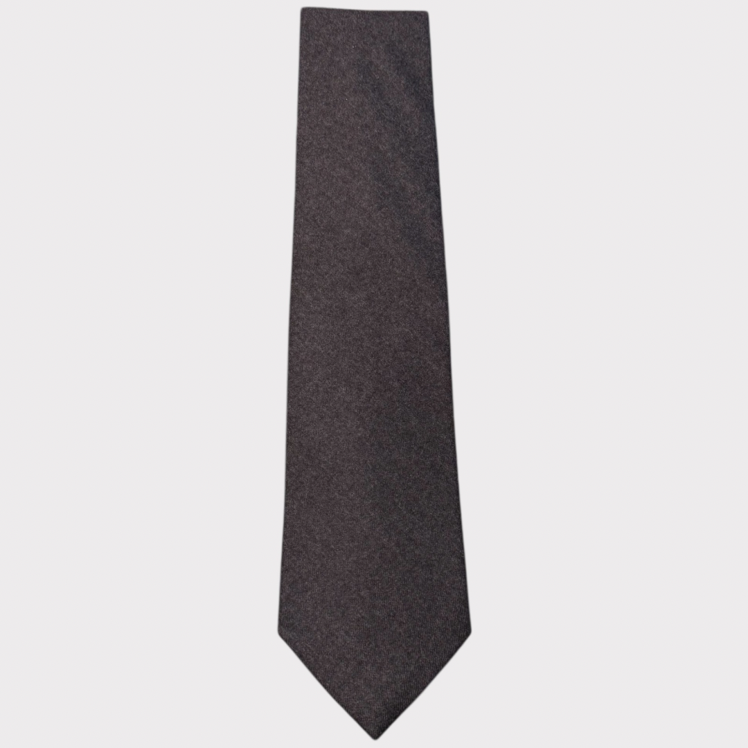 Dark gray tie on a light gray background