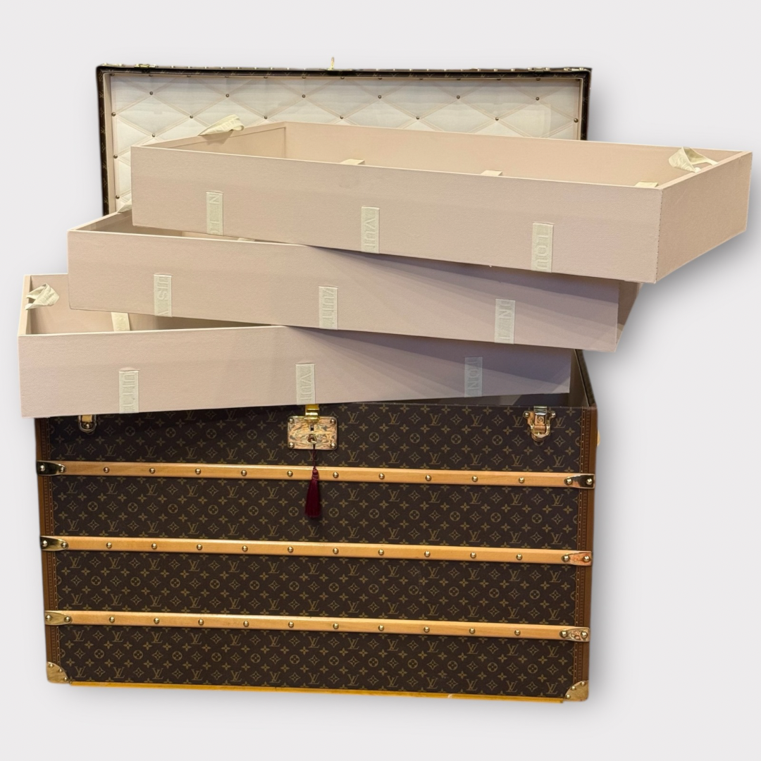 Louis Vuitton monogram trunk on a white background