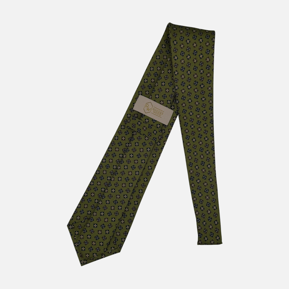 A moss coloured tie with medallions across the silk.