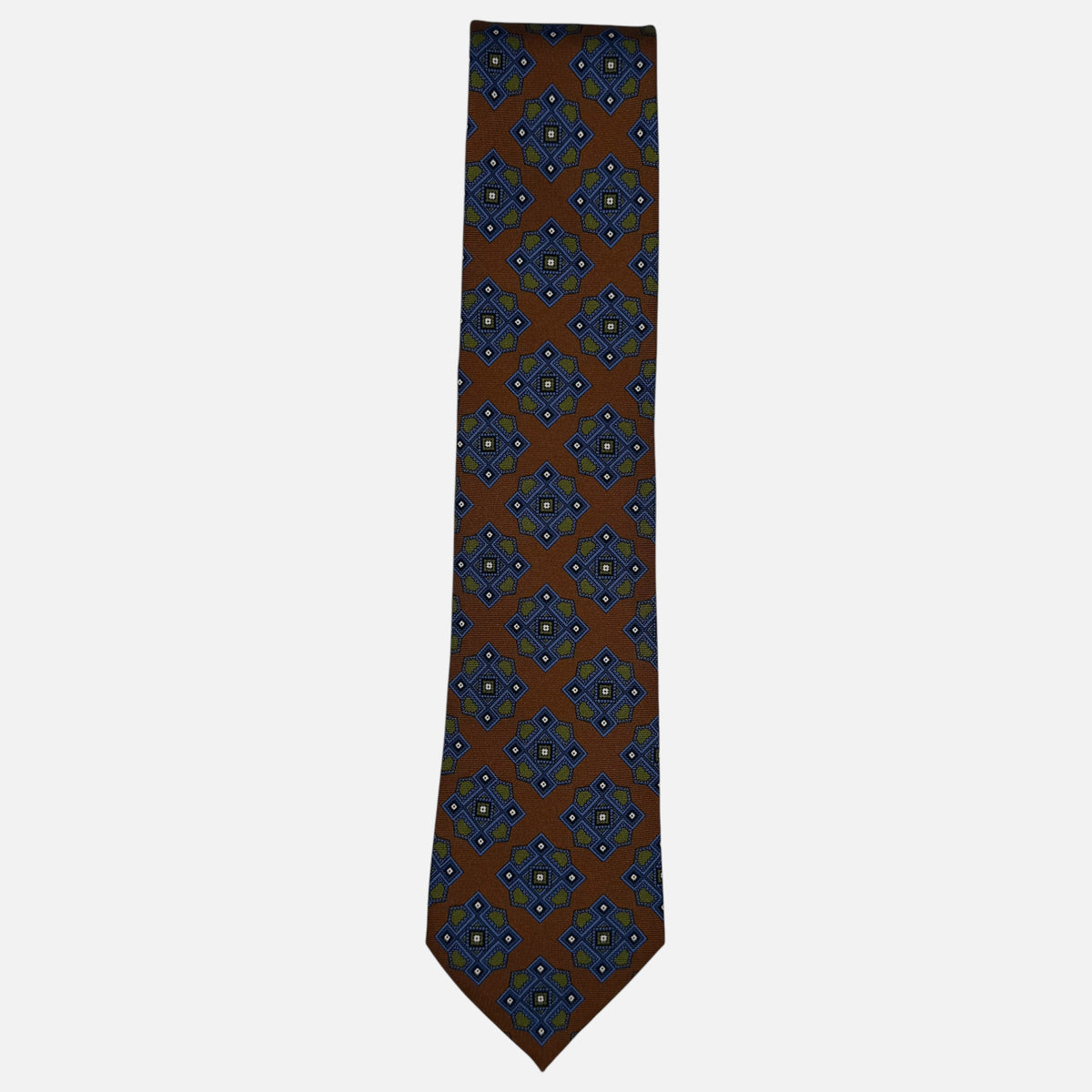 A Cognac neck tie with large blue and green medallion. 