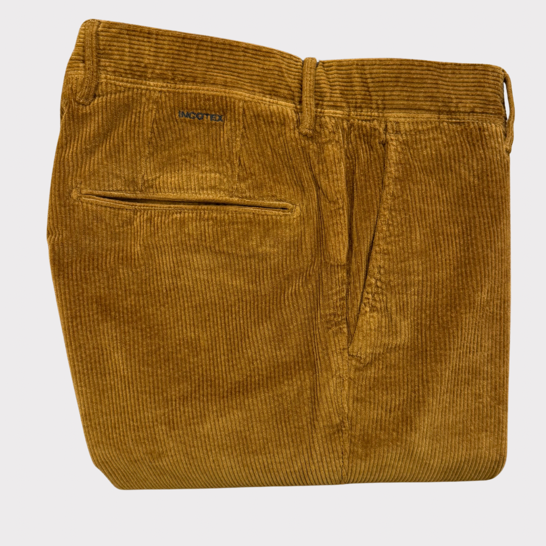Tan corduroy pants on a white background