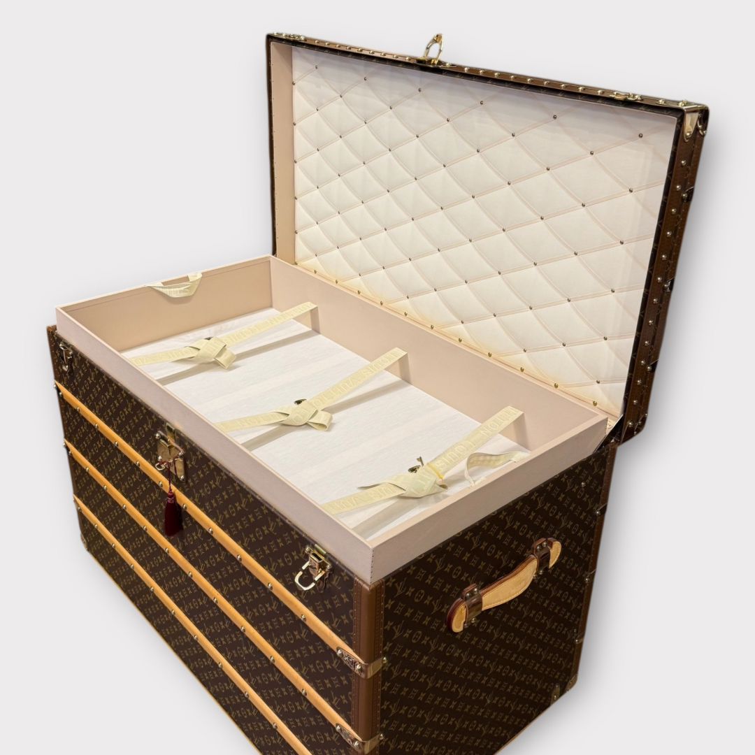 Louis Vuitton monogram trunk on a white background