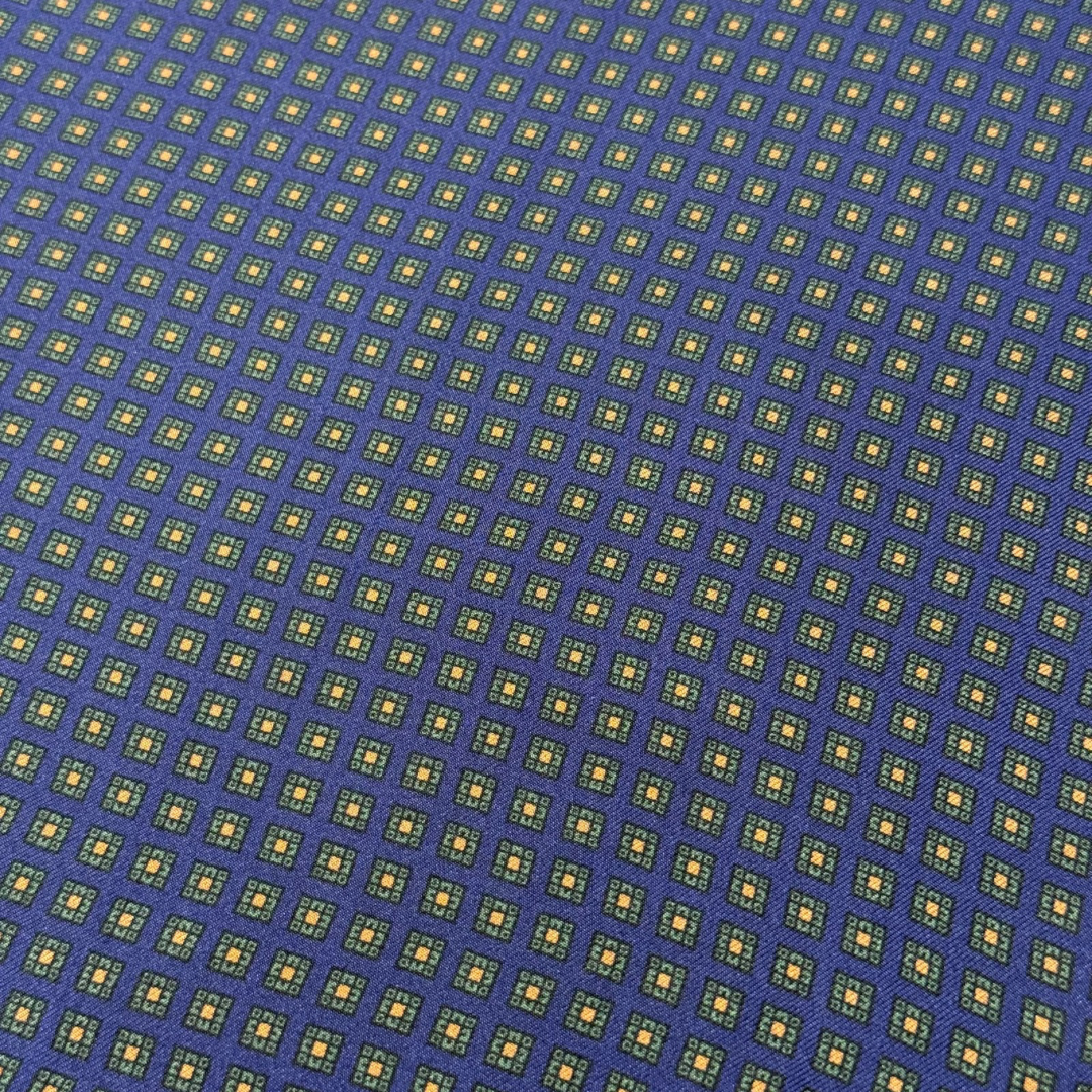 Patterned fabric with small squares on a blue background