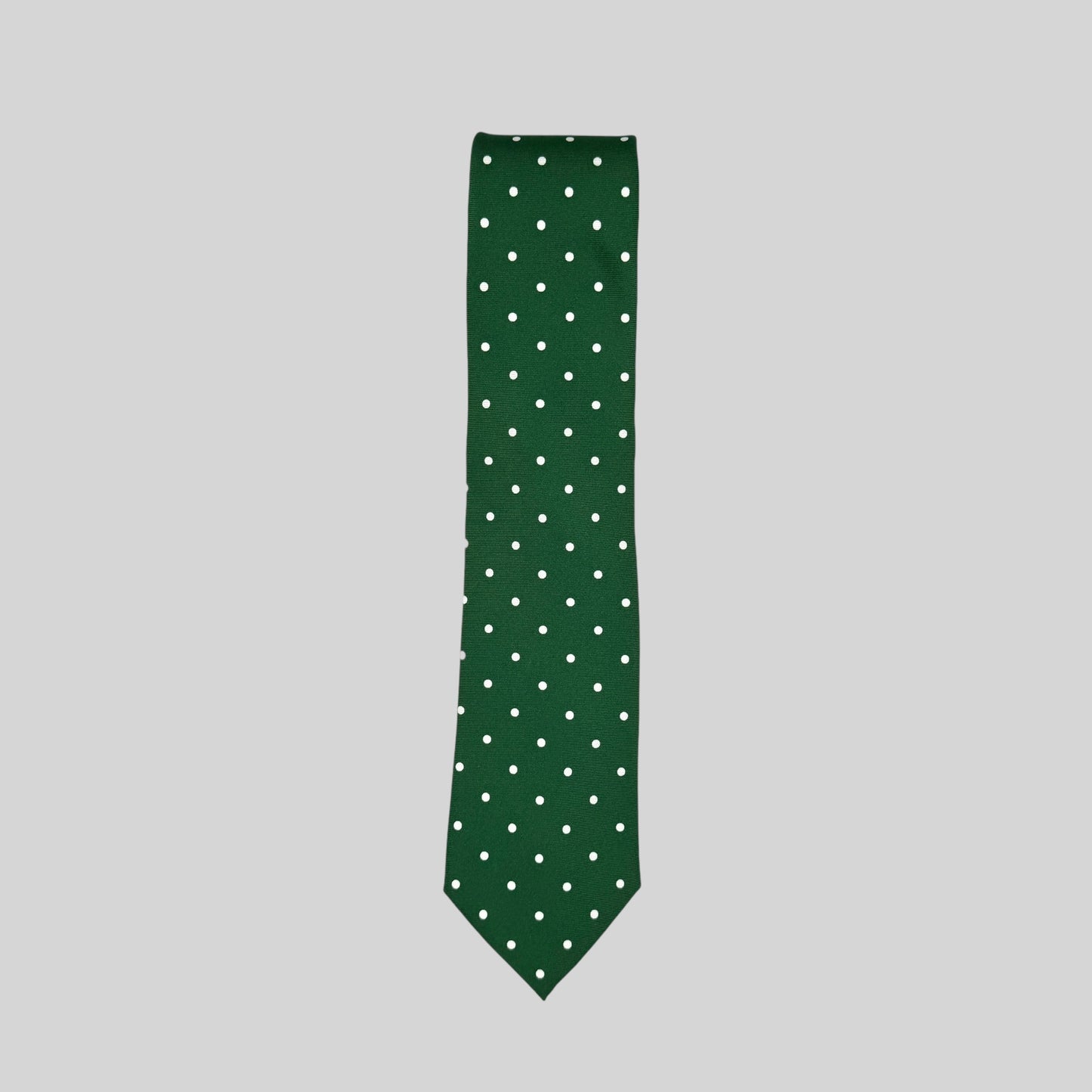 dark green Rhodes Wood tie with white polka dots