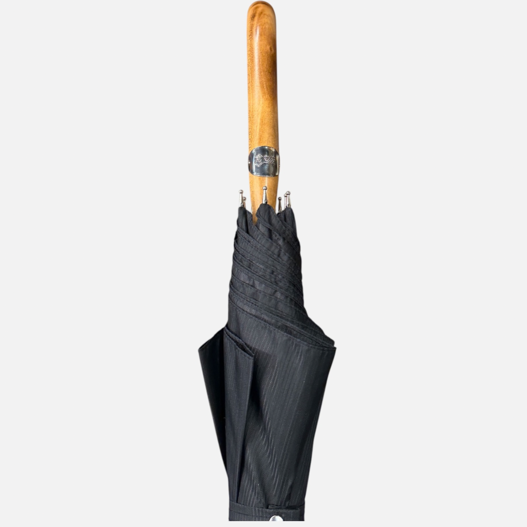A black striped umbrella with a malacca handle 