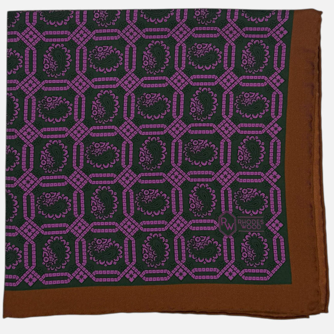 Green & pink octagon paisley repeating across the pocket square, with a brown boarder. 