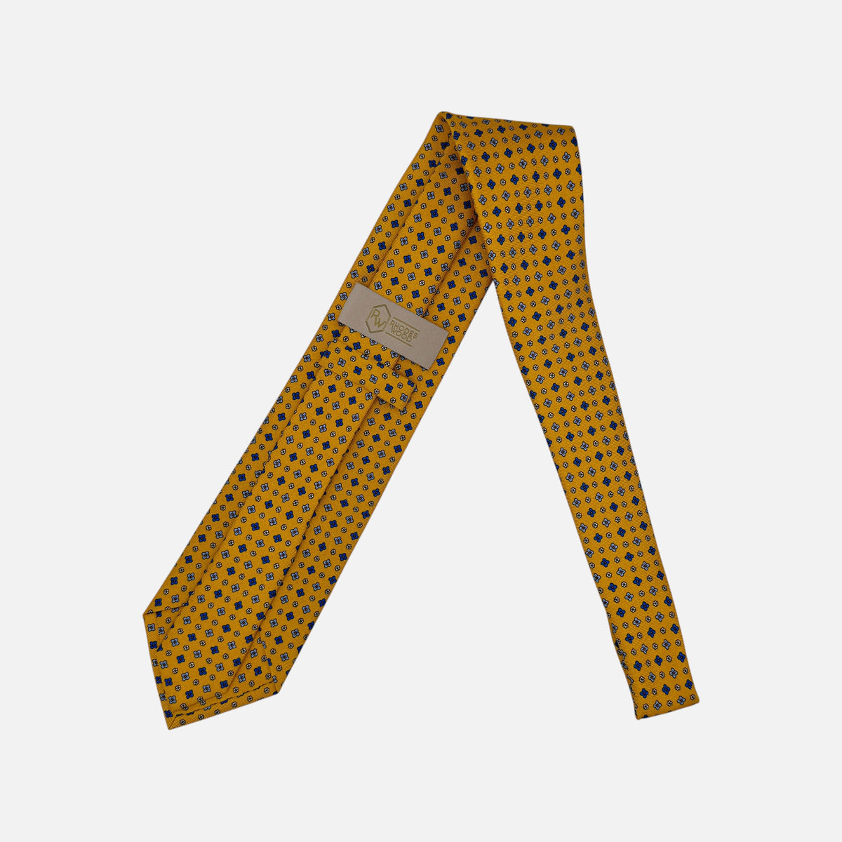 A mustard colour necktie with sky blue yellow and blue medallions. 