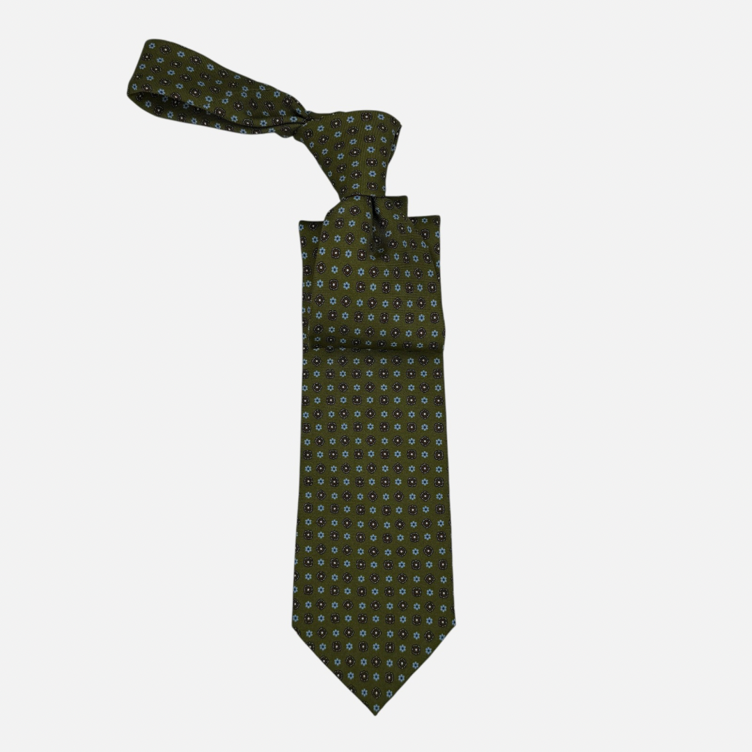Mens olive neck tie with sky blue and olive miniature rosettes repeating across the silk.