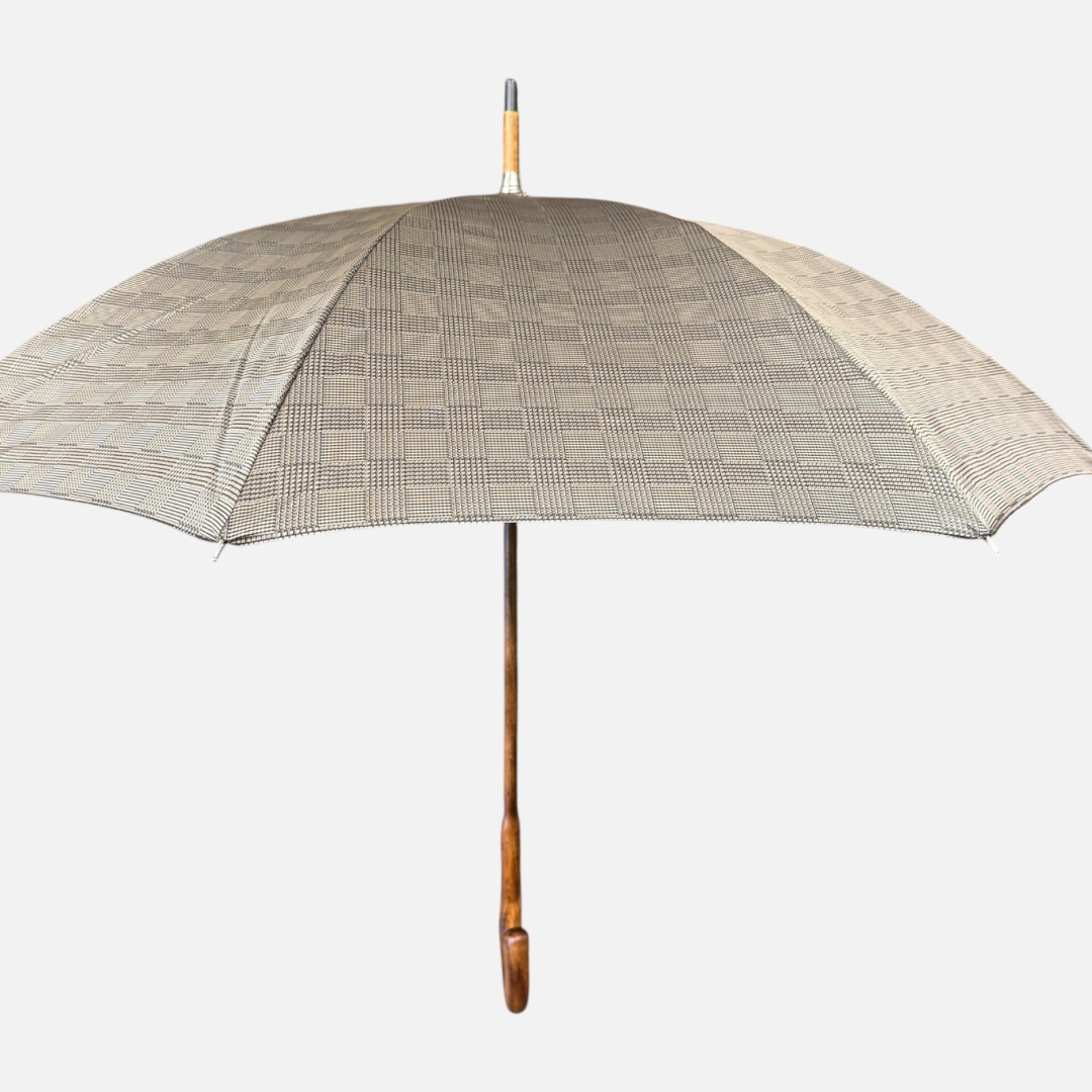 A beige check umbrella on a  malacca handle
